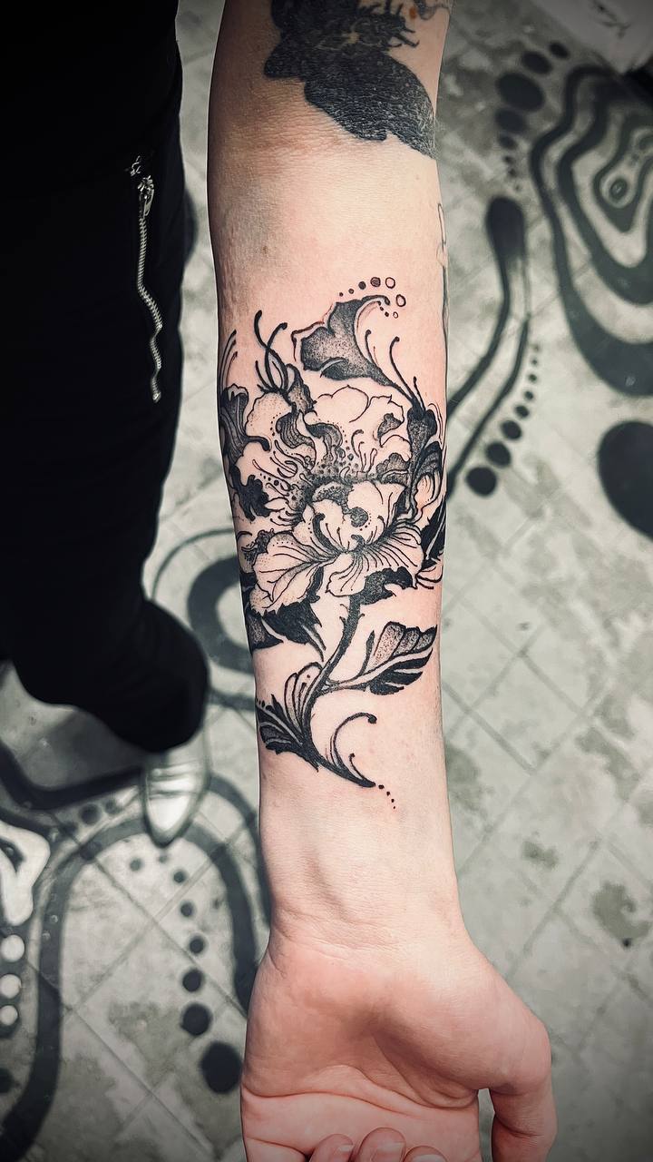 Botanical forearm tattoo