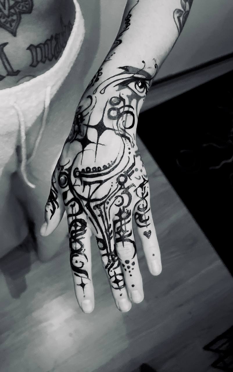 Abstract black hand tattoo