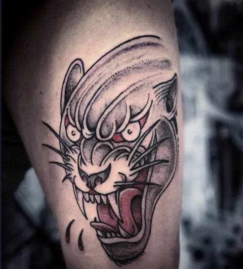 Panther tattoo on leg