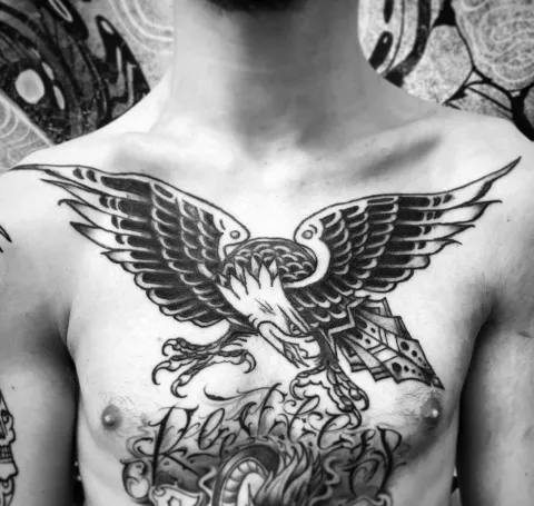 Bold eagle chest tattoo