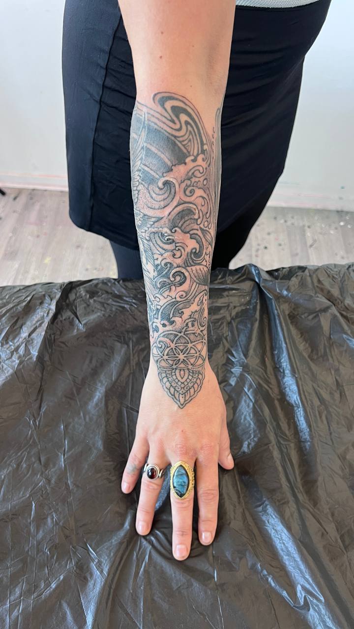 Wave and geometric hand tattoo